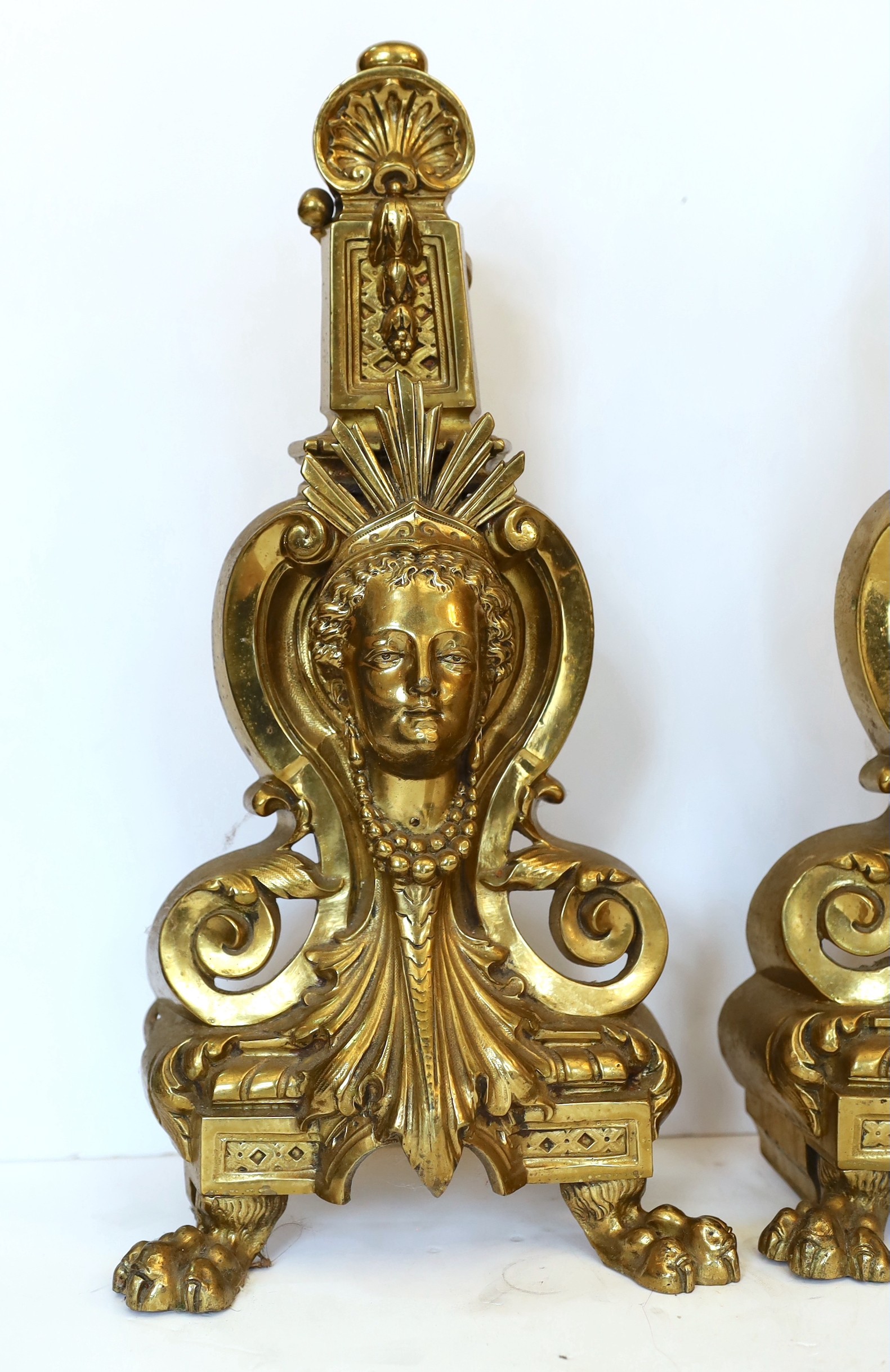 A pair of Louis XVI style gilt brass chenets, height 43cm